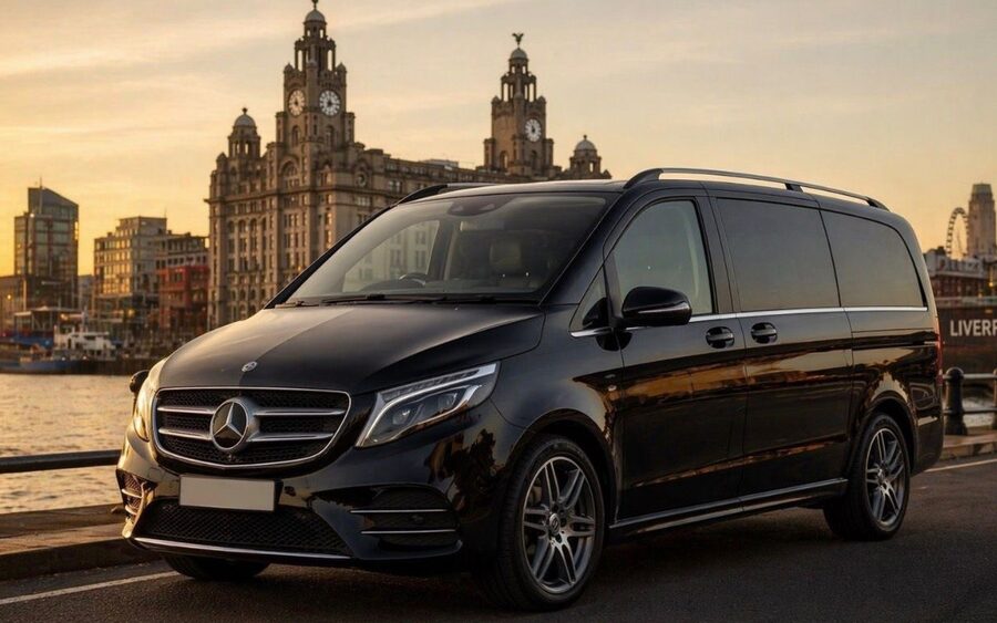 Black executive Mercedes V-Class on the Liverpool waterfront with the Royal Liver Building behind